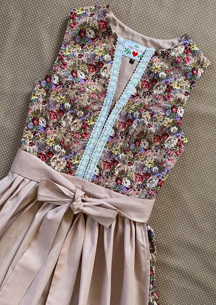 hochgeschlossenes Dirndl mit Spitze und Rosen