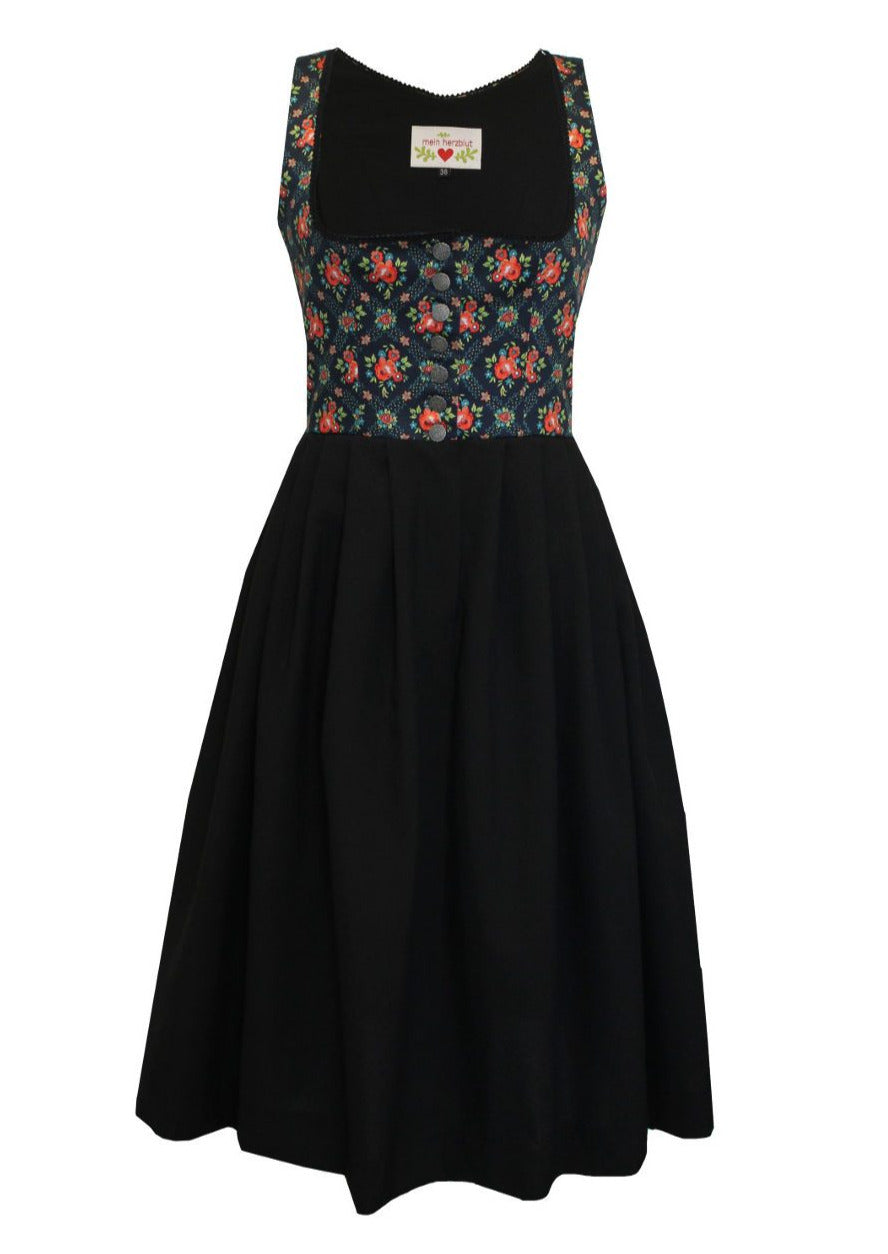Dirndl mit schwarzen Rock und außergewöhnlichen Dirndloberteil. 